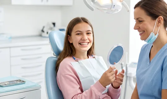 girl at orthodontist happy